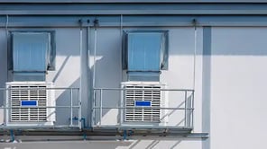 2 evaporative coolers on an outside wall