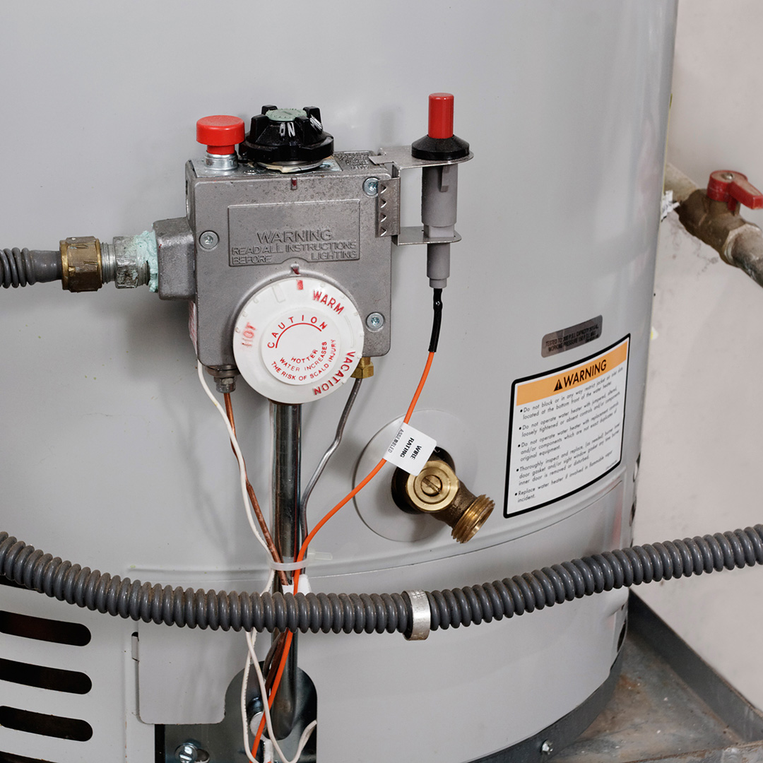 Hot water tank close up to valves Hot water tank close up to valves